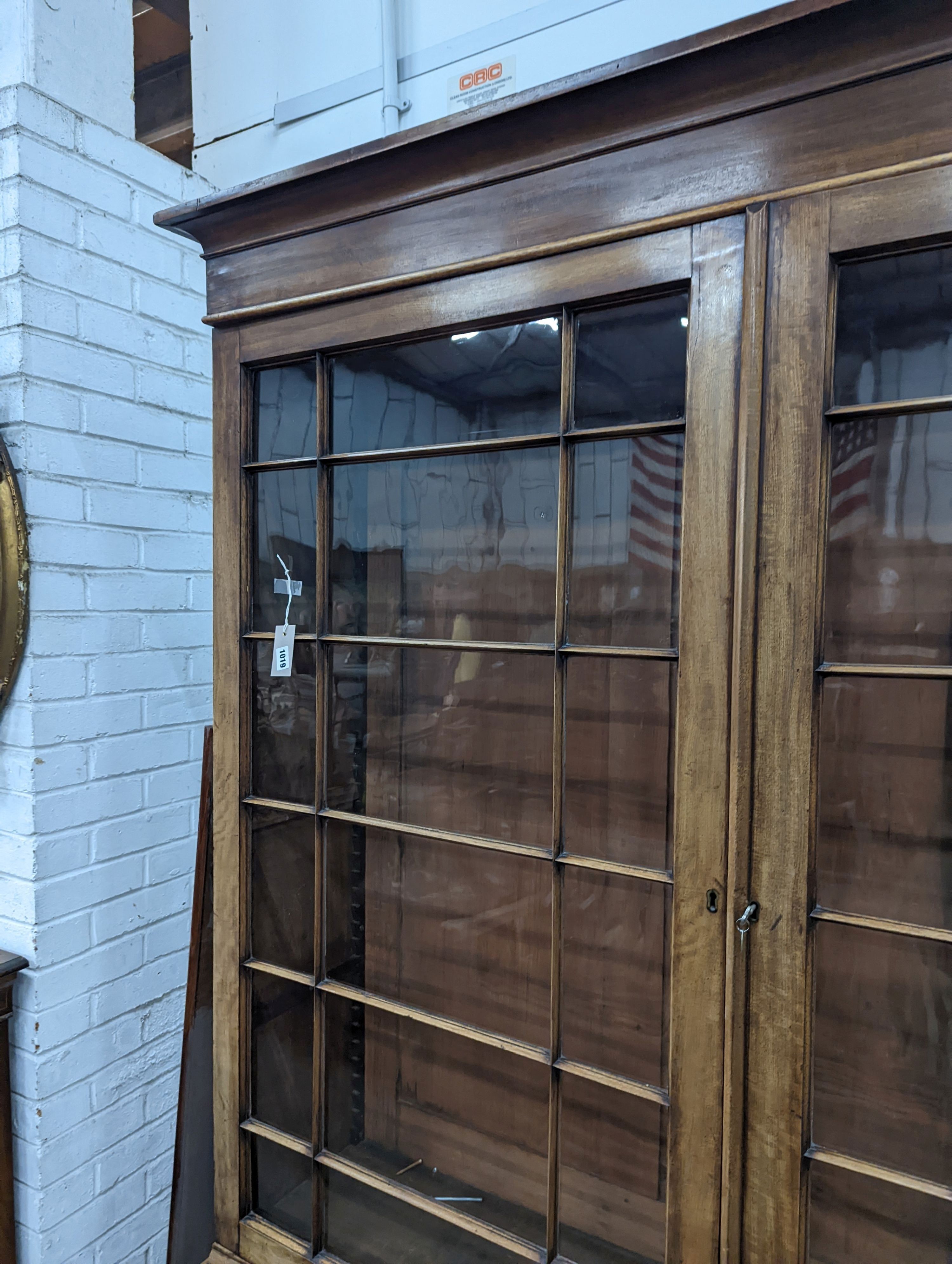 A George III style mahogany library bookcase, width 154cm, depth 38cm, height 217cm